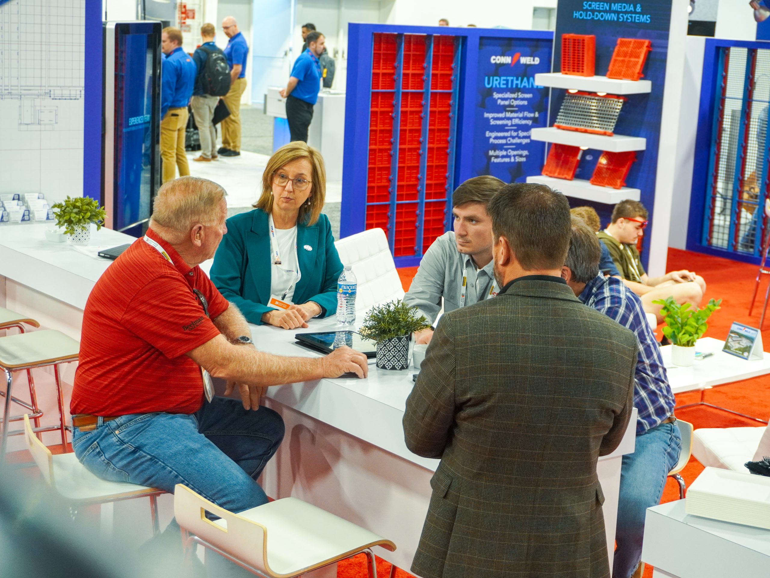 Conn-Weld team speaking with visitors at CONEXPO